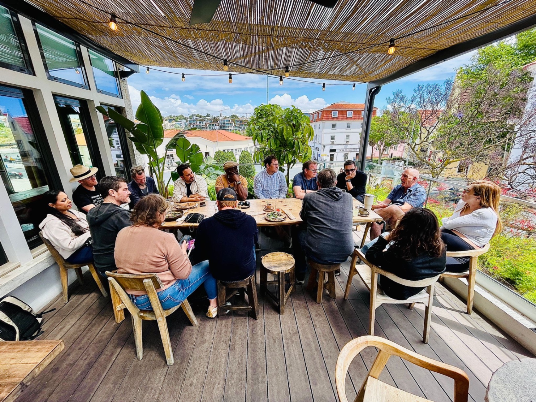 People gathered around a table at a Cascais AI Hub meetup
